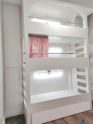 Bunk bed design with custom made shelves on each sides.