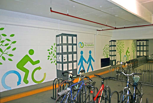 The graphic design of the cyclist logo and creating buildings with depth of one point perspective - mural painting montreal.