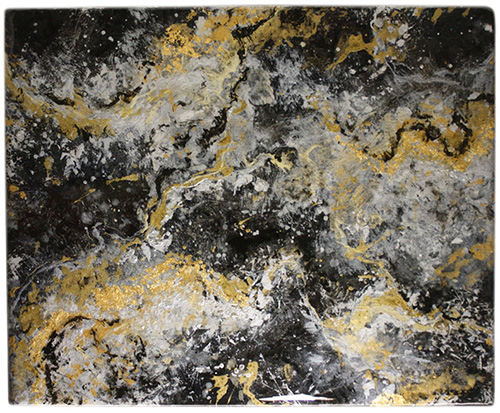 Metallic marbling of golds and silvers on a black epoxy countertops by Richard Ancheta