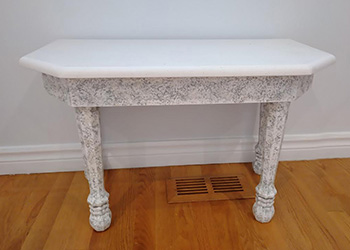 Trapezoid 6 sides table with faux granite.